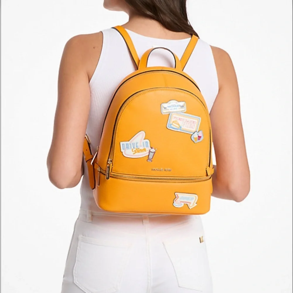 Michael Kors Vibrant Orange Backpack with Fun Patches